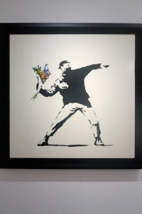 Roma, Palazzo Cipolla, mostra di Banksy "Guerra, Capitalismo & Libertà", 24 maggio - 4 settembre 2016: Il lanciatore di fiori, Gerusalemme 2003 (foto Giorgio Pagano 2016) 